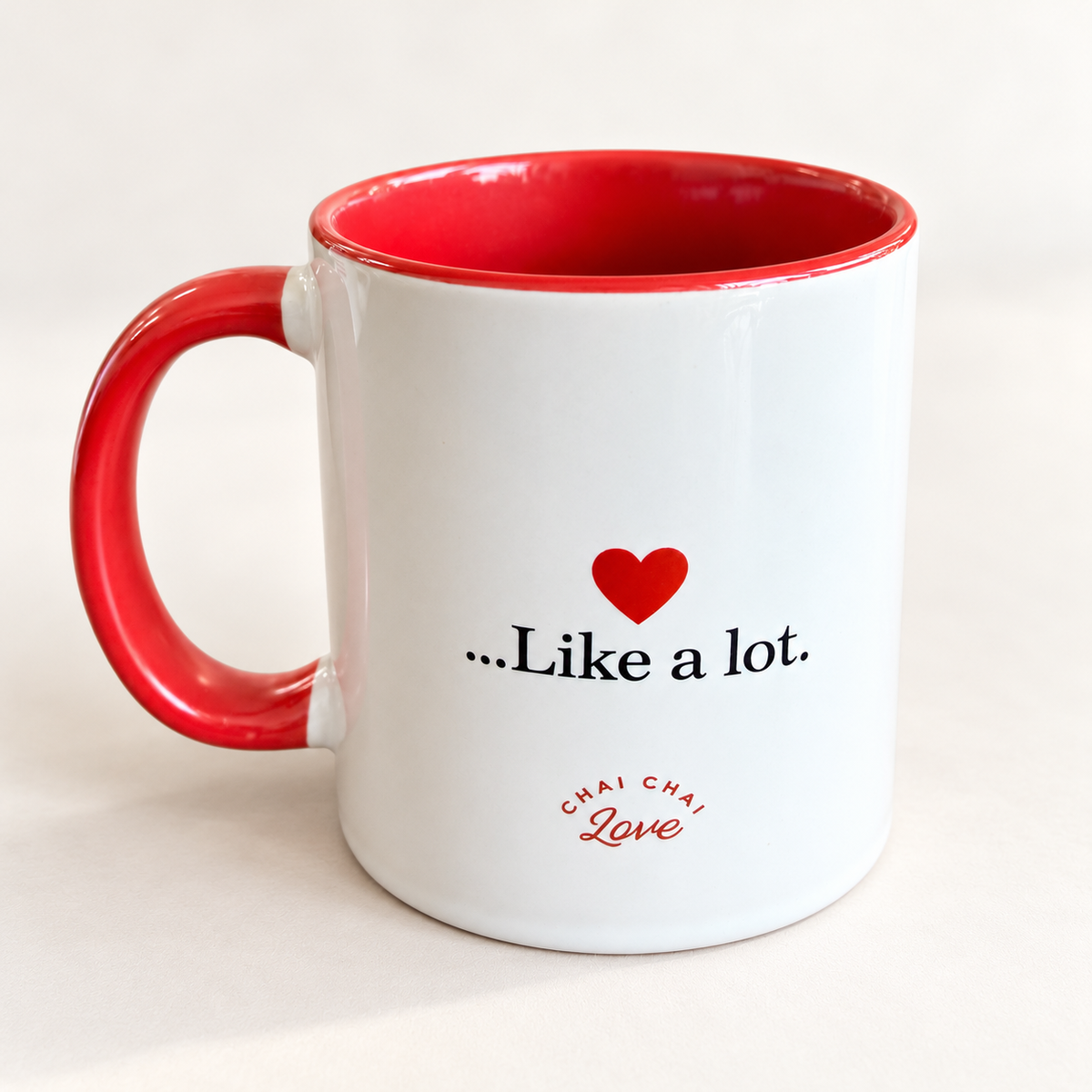 Back of Chai Love You mug with red heart, Like a lot message, and Chai Chai Love logo