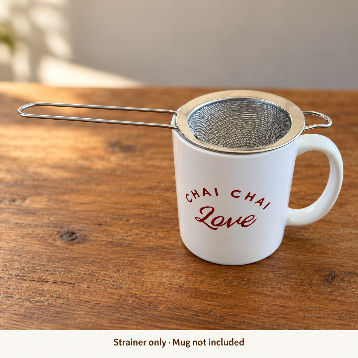 Fine mesh chai strainer resting over a Chai Chai Love mug; strainer only, mug not included