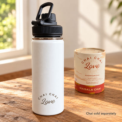 White insulated chai bottle with Chai Chai Love Masala Chai tube in the background, labeled Chai sold separately
