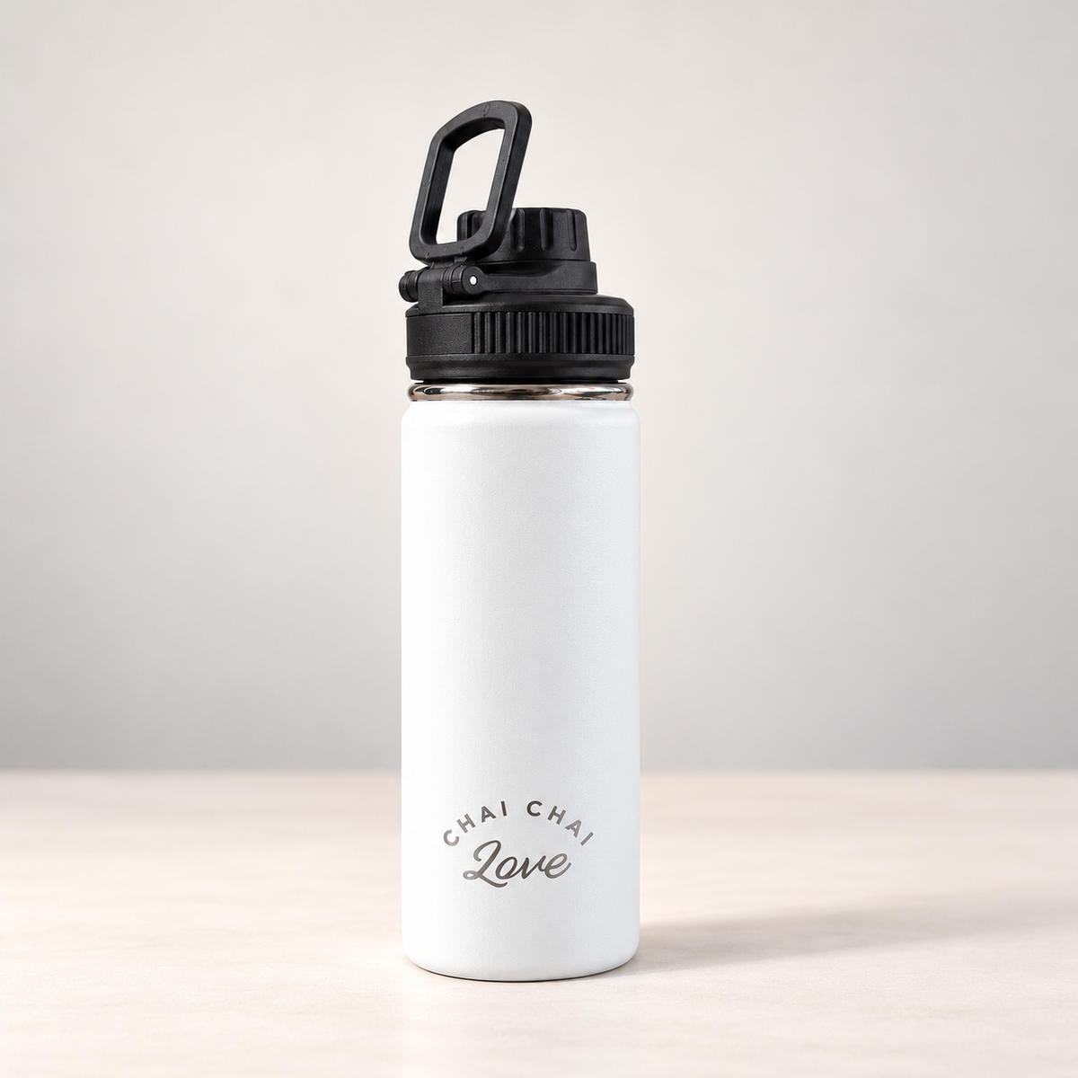 White Chai Chai Love 16 oz insulated stainless steel bottle with black lid and engraved logo