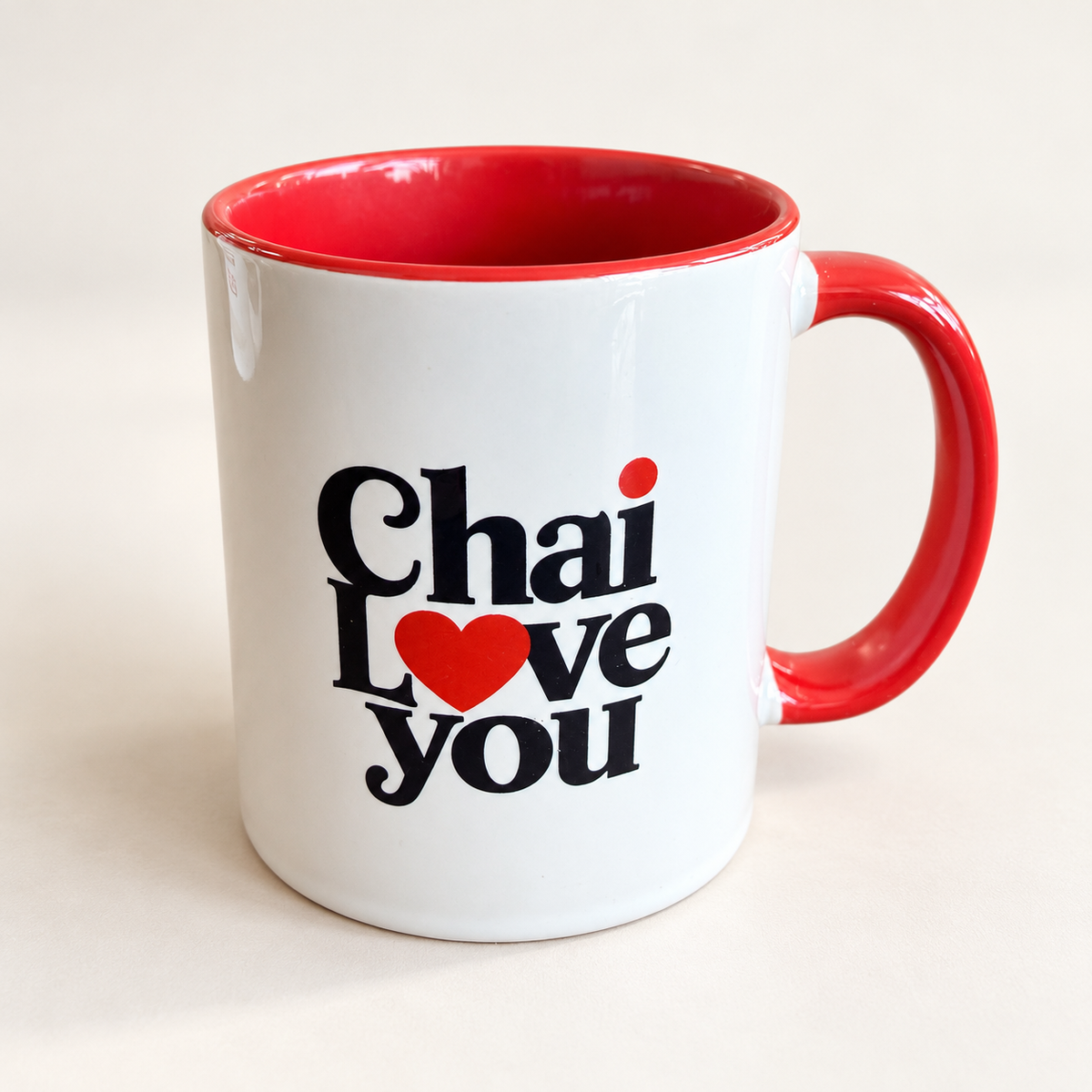 Chai Love You ceramic mug with red interior and handle, front design