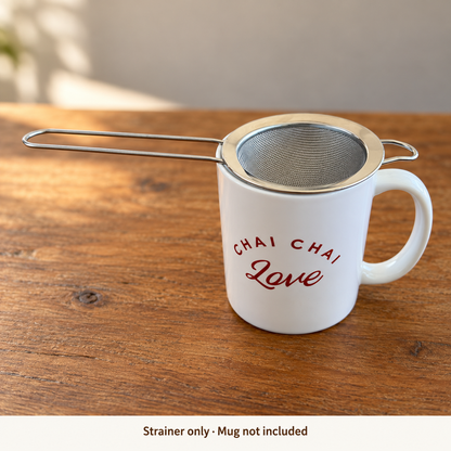 Fine mesh chai strainer resting over a Chai Chai Love mug; strainer only, mug not included